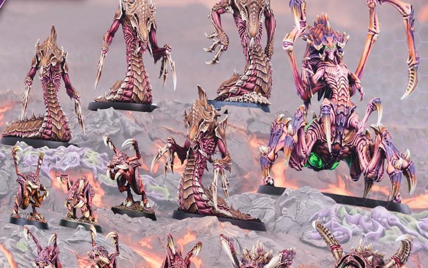Painted Zerg miniatures in crimson and bone: hydralisks, zerglings and a large spider-legged creature with a glowing green sac.